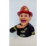 Cast iron fireman mechanical money box, height 20c