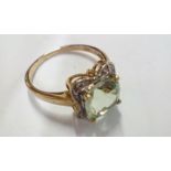 9 carat gold dress ring set with large green ameth