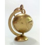 9 carat gold globe charm, 3.8 grams