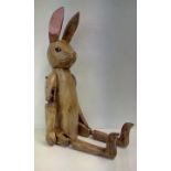 Treen figure of a rabbit with articulating limbs,