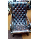 Deep buttoned leather slipper chair