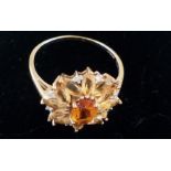 9ct gold dress ring with central orange stone, siz