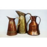 Three jugs in copper and brass to include one earl