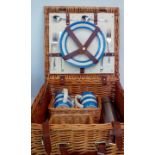 Wicker picnic basket containing TG Green and Co