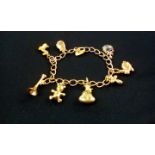 9 ct gold charm bracelet with 8 charms and heart l