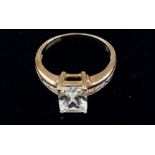 9 ct gold dress ring with large central stone and