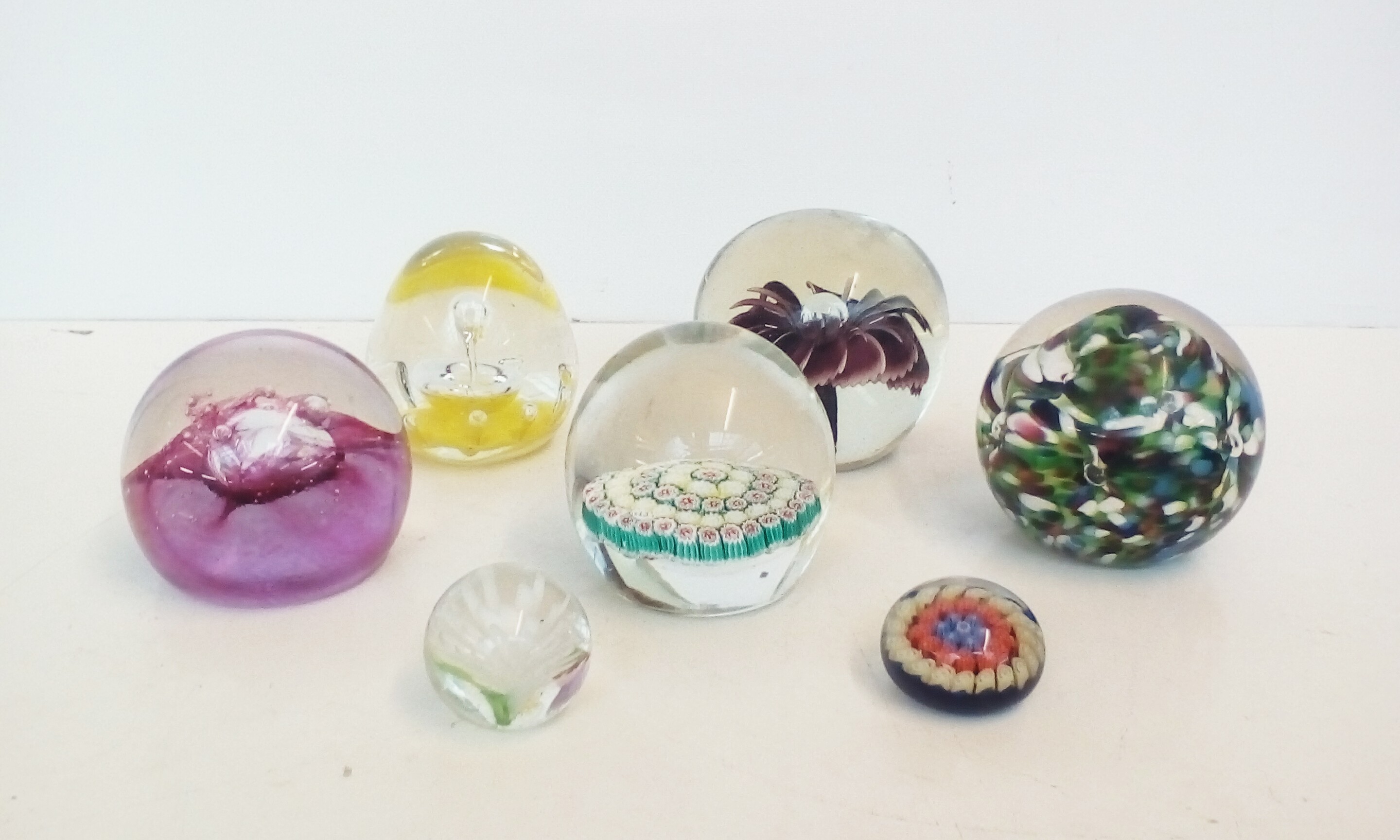 Collection of 7 paper weights