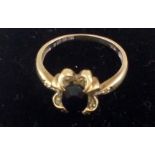 9 ct gold dress ring with central red stone, size