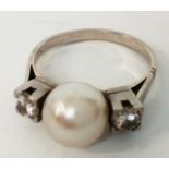 Diamond and pearl ring set on a platinum band