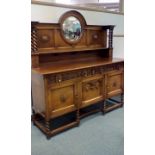 Oak Arts & Crafts style sideboard with carved deco