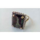 9 carat gold ring set with mystic topaz and diamon
