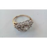 9 carat gold cluster ring set with white gemstones