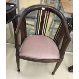 An Edwardian mahogany corner chair