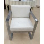 A retro square chrome and white upholstered chair