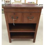 A small side cabinet with two drawers and compartment with leather top inlay