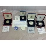 Four cased Royal Mint silver proof coins,