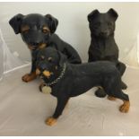 A model of a Rottweiller dog and alsation puppy