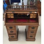 An Edwardian mahogany roll-top desk