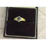 An 18ct diamond and sapphire dress ring