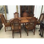 A full dining room suite to inc an extended dining table with inlaid top and set of six rattan