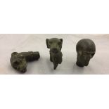 Three bronze walking stick tops to inc skull and dogs