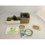 A quantity of car badges and tax discs - WITHDRAWN