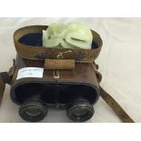 A pair cased Aitcheson binoculars;