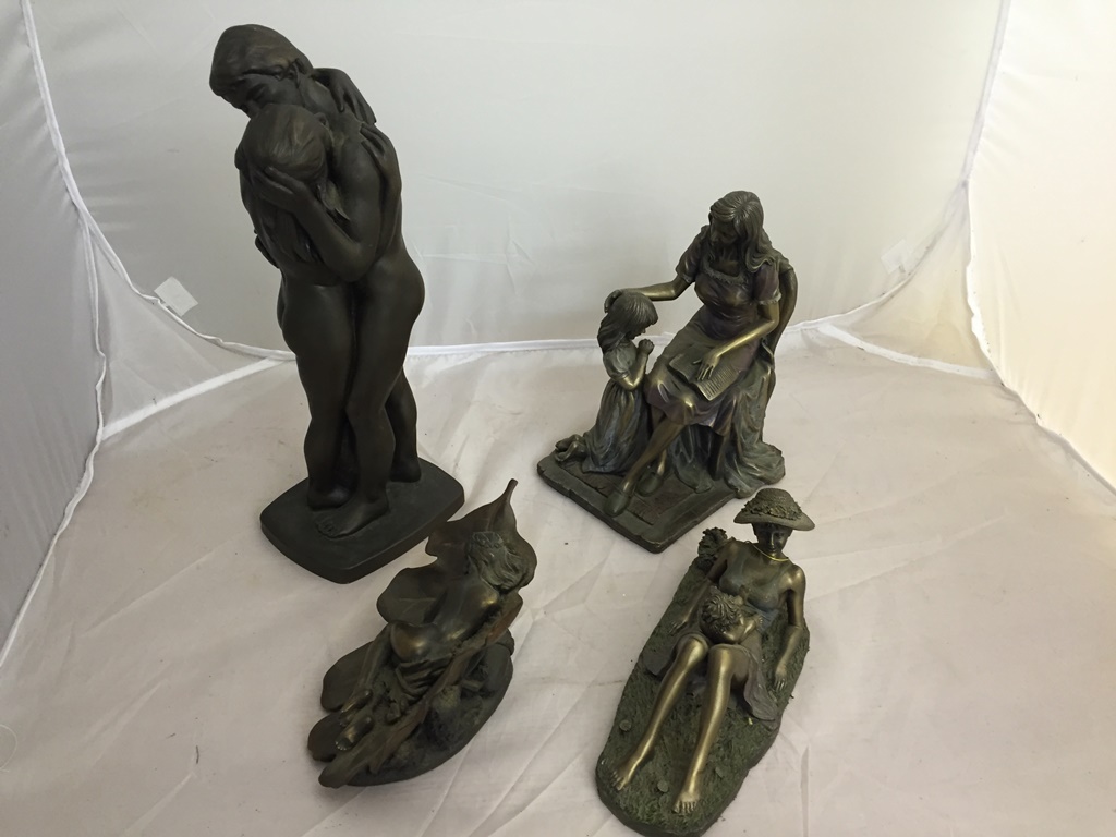 Four bronzed resin figures