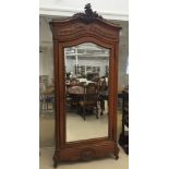 A French 19th century mirror-fronted armoire