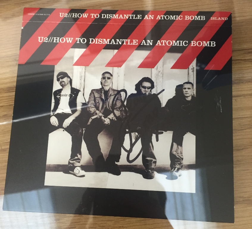 A framed U2 cover signed Bono