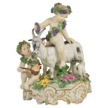 An 18th Century Hochst Porcelain Group: the central putti astride a goat wearing garlands of grapes