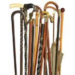 16 Walking Sticks/Parasol: To include an opalescent glass handled parasol,
