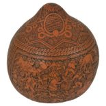 A Peruvian Carved Gourd: Intricately incised with figural & foliate decoration