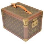 A Louis Vuitton Vanity Case: In LV Monogrammed livery to the outside,