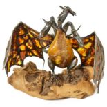 An Amber Dragon: A silver dragon with hinged wings,