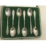 A cased HM silver teaspoon