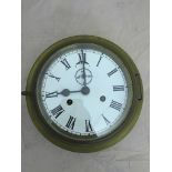 A brass bulkhead clock