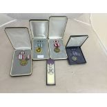 Five cased US medals;