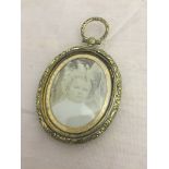 An early 20th century gold-plated photographic locket