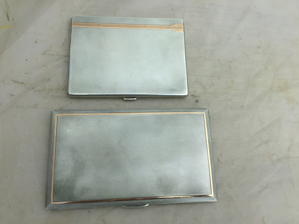 Two hallmarked silver and gold detail cigarette cases