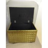 A stylish brass small log box