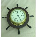 A Schatz bulkhead clock with wheel surround