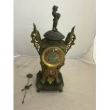 A 19th century mantel clock set with Newton plaque