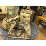 Two Burberry holdalls;