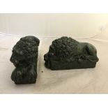 19th century serpentine carved lions lying upon rectangular bases