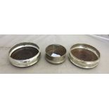 Three hallmarked silver wine coasters