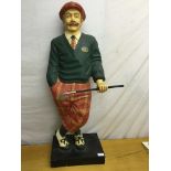 A large figure of a golfer,