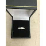 An 18ct white gold diamond ring set with princess cut and brilliant cut diamonds