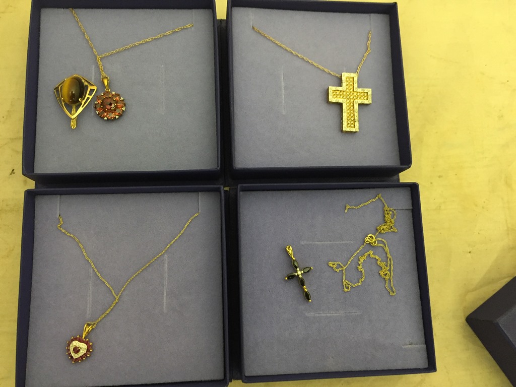 Five gold pendants