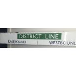 A District Line overhead enamel "Eastbound/Westbound" sign
